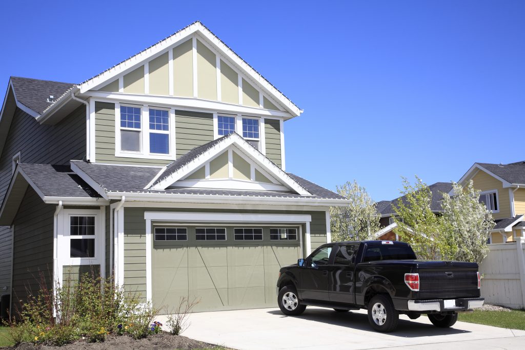 Pickup truck in the driveway of a home for an at-home test drive
