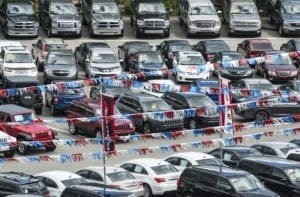 cars and trucks for sale on a dealership lot